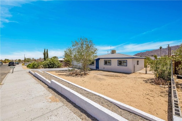 view of front of property with a mountain view