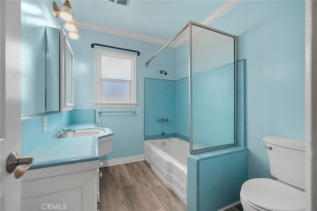 full bathroom featuring crown molding, shower / tub combination, vanity, toilet, and wood finished floors