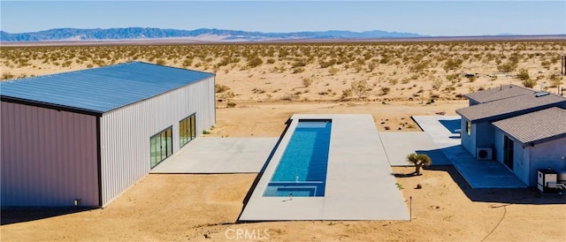 60810 Cole Ln, Landers, CA 92285 - back of property featuring view of desert, a mountain view, a pool, and a view of rural / pastoral area