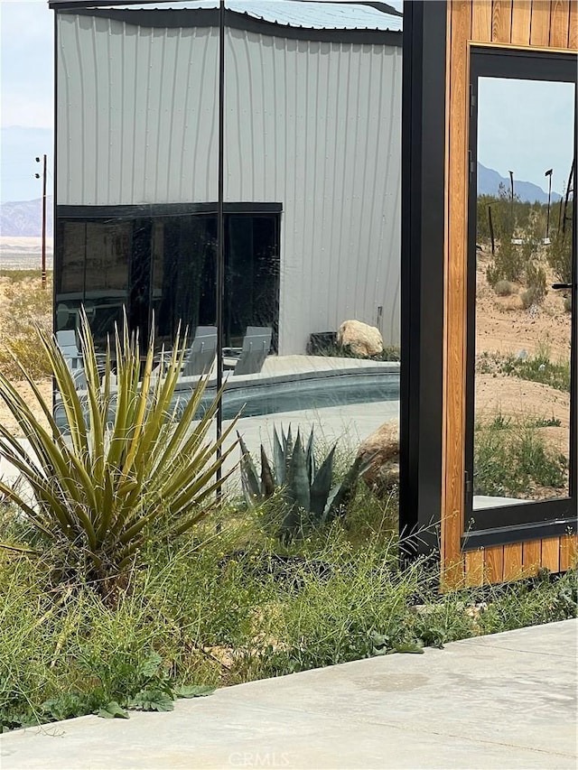 60810 Cole Ln, Landers, CA 92285 - view of home's exterior featuring a mountain view and a metal roof