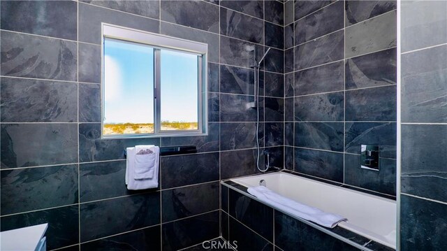 60810 Cole Ln, Landers, CA 92285 - bathroom featuring tiled bath and tiled shower