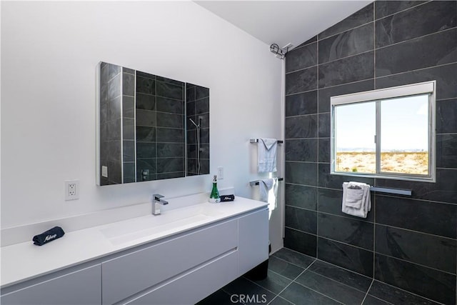 60810 Cole Ln, Landers, CA 92285 - bathroom featuring vaulted ceiling, vanity, and tile patterned floors
