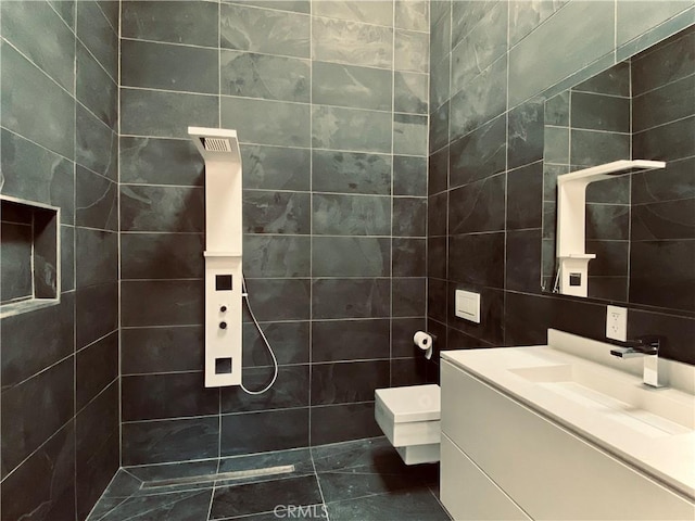 60810 Cole Ln, Landers, CA 92285 - bathroom featuring tile walls, vanity, and tiled shower