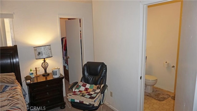 bedroom featuring tile patterned floors and ensuite bathroom