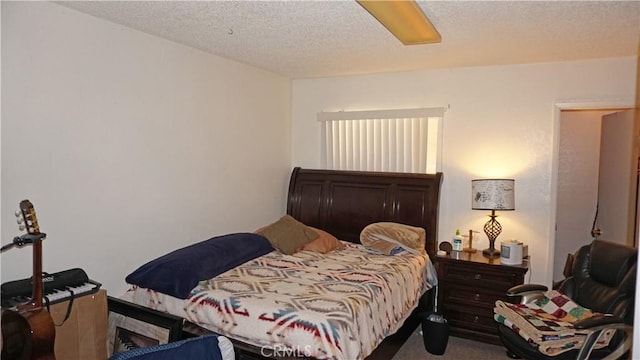carpeted bedroom featuring a textured ceiling