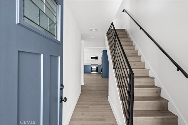 2937 W Blvd, Los Angeles, CA 90016 - stairway featuring baseboards and wood finished floors