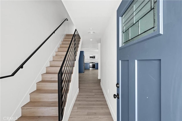 2937 W Blvd, Los Angeles, CA 90016 - staircase featuring baseboards and wood finished floors