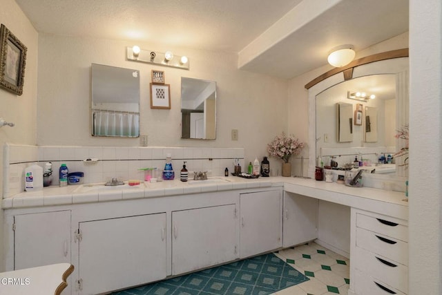 full bath featuring vanity and decorative backsplash