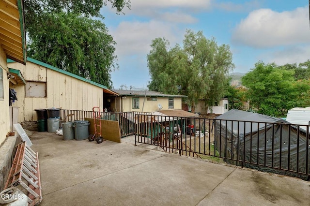 view of patio with fence