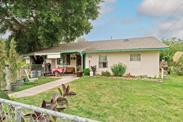ranch-style home with stucco siding, a porch, and a front lawn
