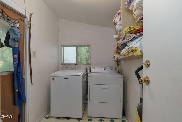 laundry room featuring laundry area, washer and clothes dryer, and light floors