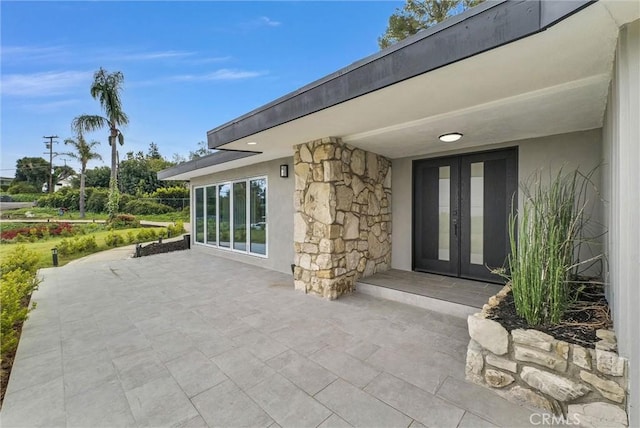view of patio featuring french doors