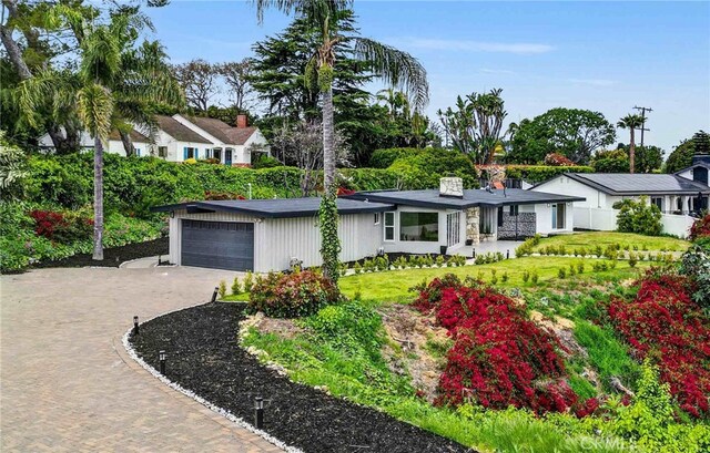 43 Rockinghorse Rd, Rancho Palos Verdes, CA 90275 - view of front of property with driveway, an attached garage, a front lawn, a chimney, and a porch