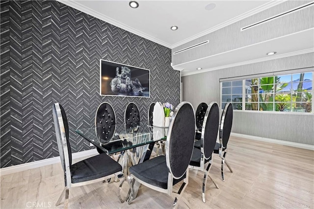dining room featuring recessed lighting, baseboards, ornamental molding, and wood finished floors