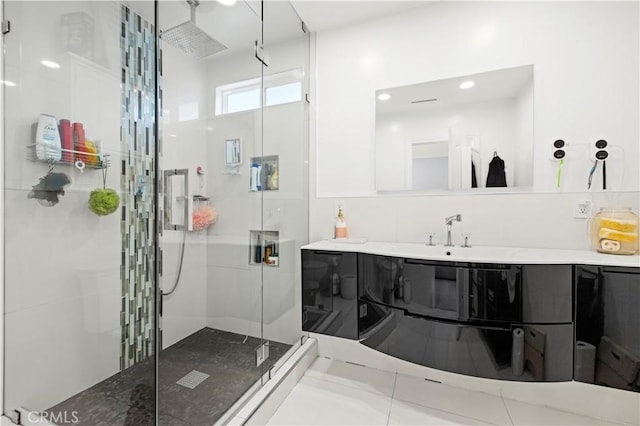 full bathroom with vanity and a stall shower