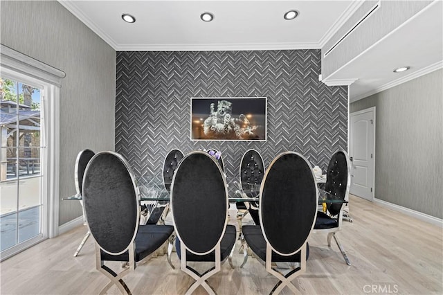 rec room with crown molding, recessed lighting, an accent wall, and light wood finished floors
