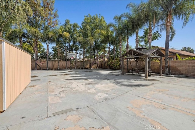 view of patio / terrace featuring a gazebo and fence