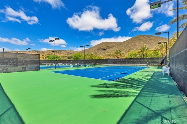 28345 Hearthside Dr, Menifee, CA 92584 - view of tennis court with a mountain view and fence