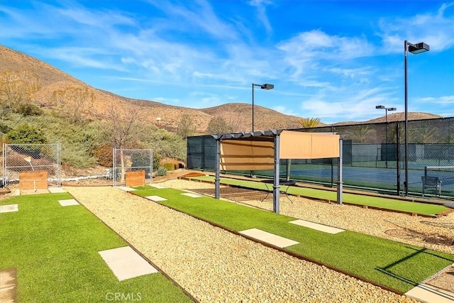 28345 Hearthside Dr, Menifee, CA 92584 - view of property's community featuring fence, a mountain view, and a tennis court