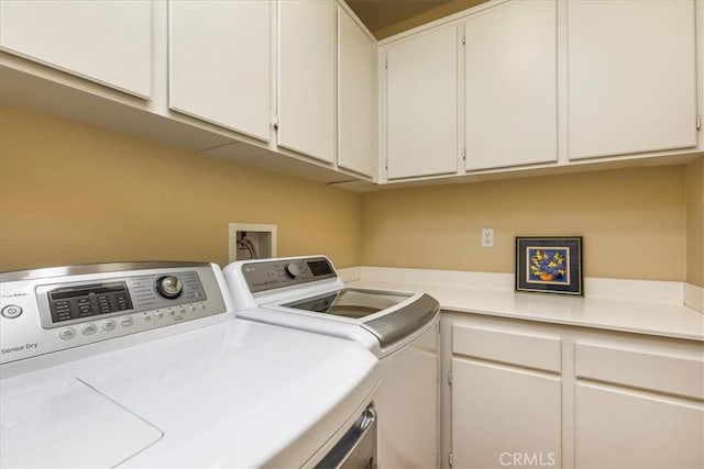 28345 Hearthside Dr, Menifee, CA 92584 - clothes washing area featuring washing machine and dryer and cabinet space