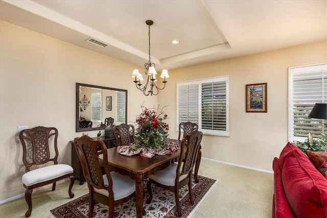 28345 Hearthside Dr, Menifee, CA 92584 - carpeted dining area featuring a chandelier, baseboards, a tray ceiling, recessed lighting, and healthy amount of natural light