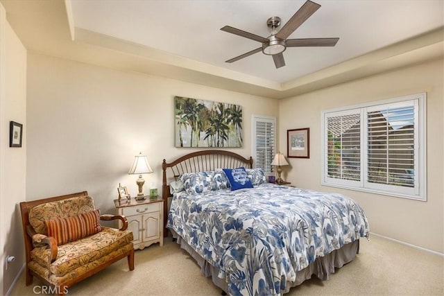 28345 Hearthside Dr, Menifee, CA 92584 - bedroom featuring light carpet, a raised ceiling, baseboards, and ceiling fan