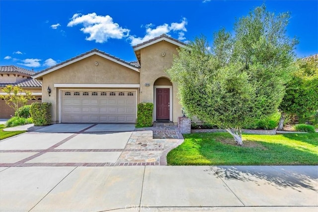28345 Hearthside Dr, Menifee, CA 92584 - view of front of property with stucco siding, an attached garage, driveway, and a front yard