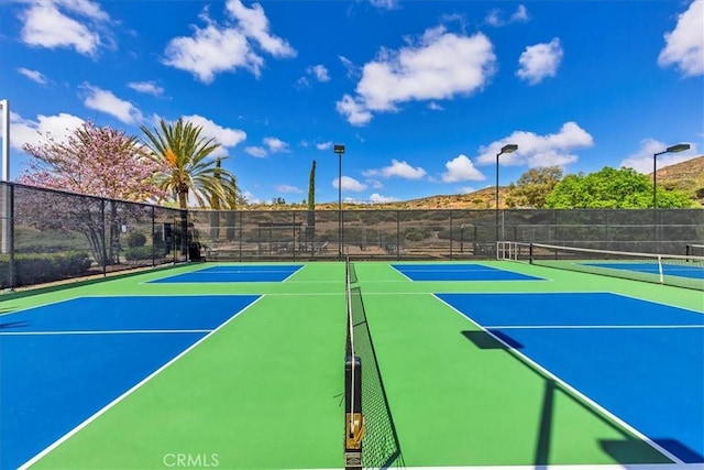 28345 Hearthside Dr, Menifee, CA 92584 - view of tennis court featuring community basketball court and fence