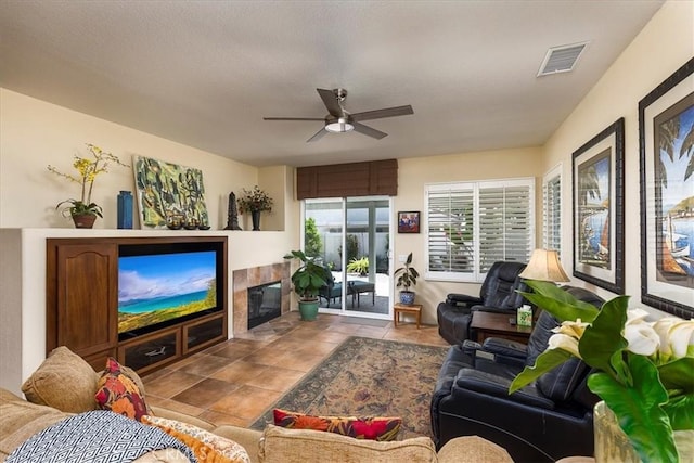 28345 Hearthside Dr, Menifee, CA 92584 - living room featuring ceiling fan and a tile fireplace