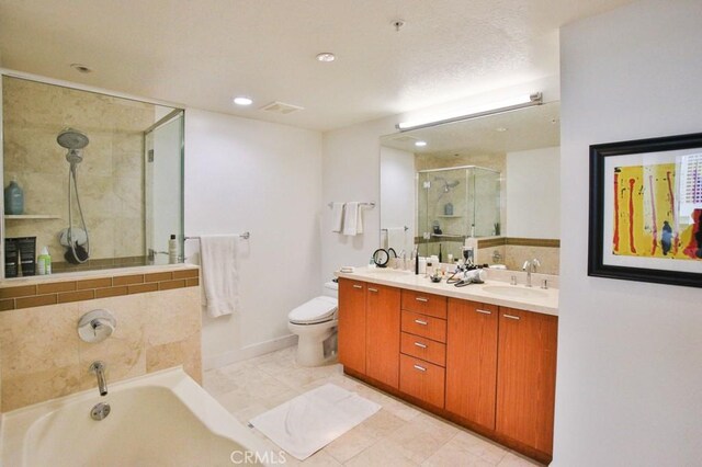 full bathroom featuring double vanity, a garden tub, a stall shower, a sink, and recessed lighting