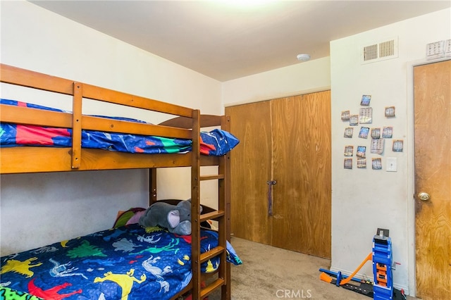 bedroom with visible vents and carpet floors