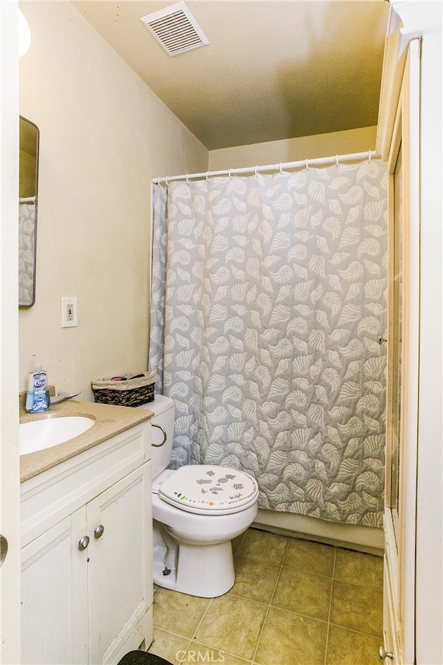 full bathroom with vanity, tile patterned flooring, toilet, and visible vents