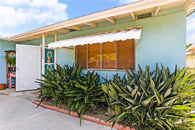 exterior space with stucco siding