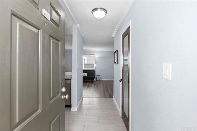 hall with crown molding and baseboards