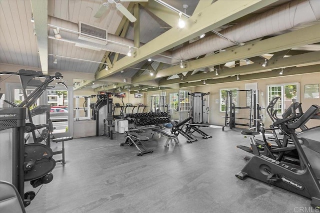 workout area with visible vents and vaulted ceiling