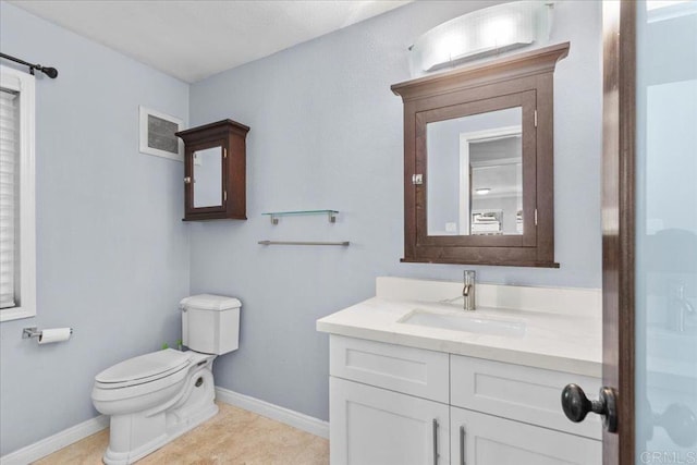 bathroom featuring vanity, baseboards, toilet, and visible vents