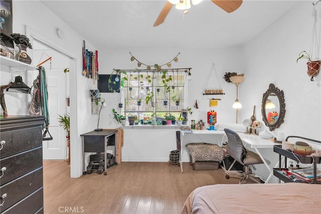 bedroom featuring a ceiling fan and wood finished floors