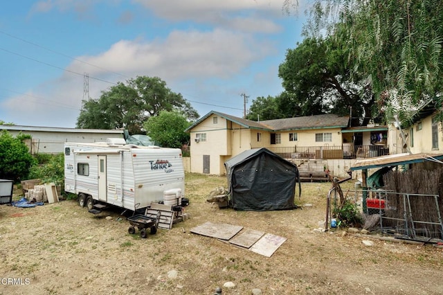 1151 Grant Line St Unit A & B, Santa Paula, CA 93060 - rear view of property with fence and an outdoor structure