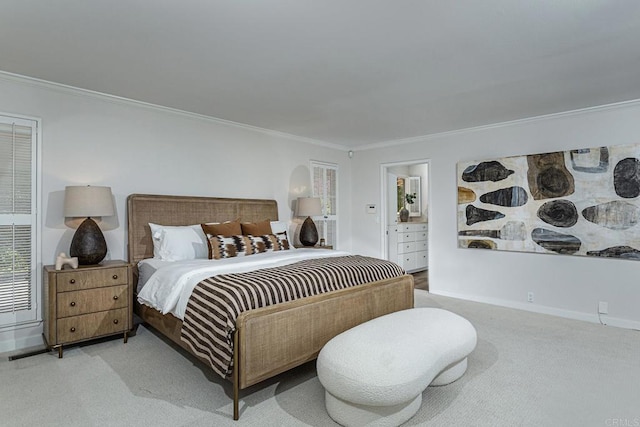 bedroom featuring crown molding, baseboards, and carpet floors