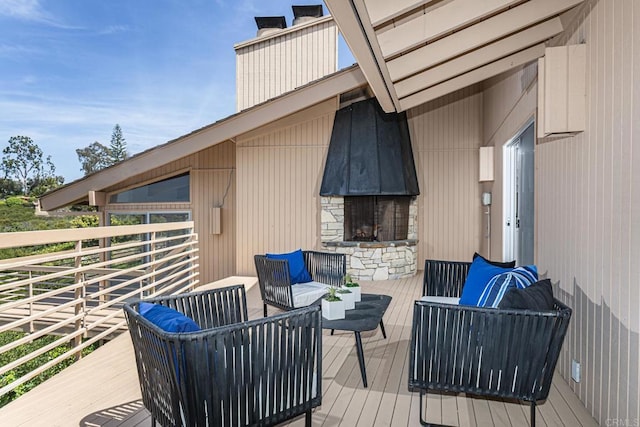 wooden deck featuring an outdoor hangout area