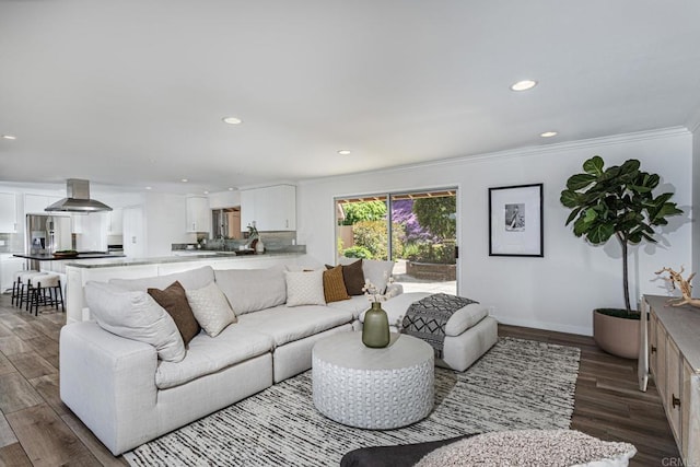living area featuring recessed lighting, baseboards, ornamental molding, and dark wood-type flooring