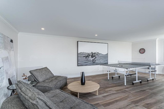 playroom featuring recessed lighting, ornamental molding, baseboards, and wood finished floors