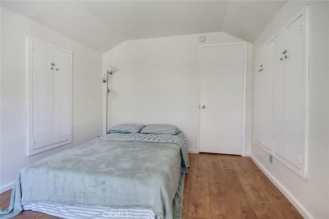 133 Holmes Ln, Sugarloaf, CA 92386 - bedroom with vaulted ceiling and wood finished floors