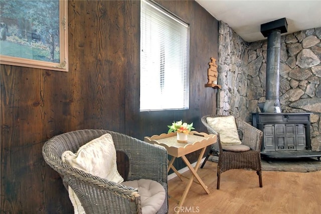 133 Holmes Ln, Sugarloaf, CA 92386 - living area featuring a wood stove, wood finished floors, and wood walls