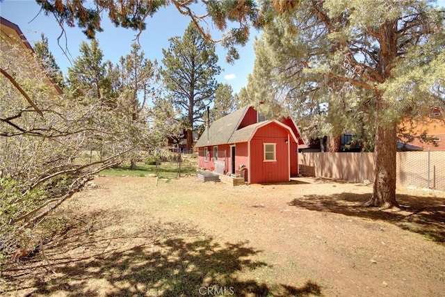 133 Holmes Ln, Sugarloaf, CA 92386 - view of yard featuring an outdoor structure, a shed, and fence