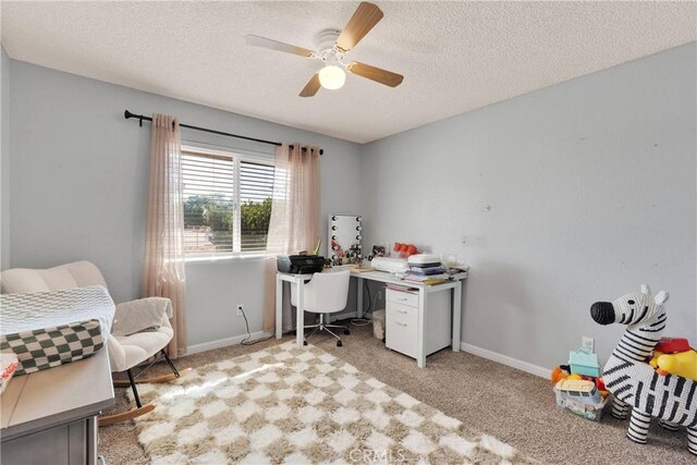 12546 Snapping Turtle Rd, Apple Valley, CA 92308 - carpeted office featuring ceiling fan, a textured ceiling, and baseboards