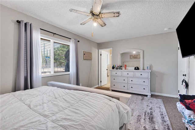 bedroom with baseboards, a ceiling fan, carpet flooring, and a textured ceiling