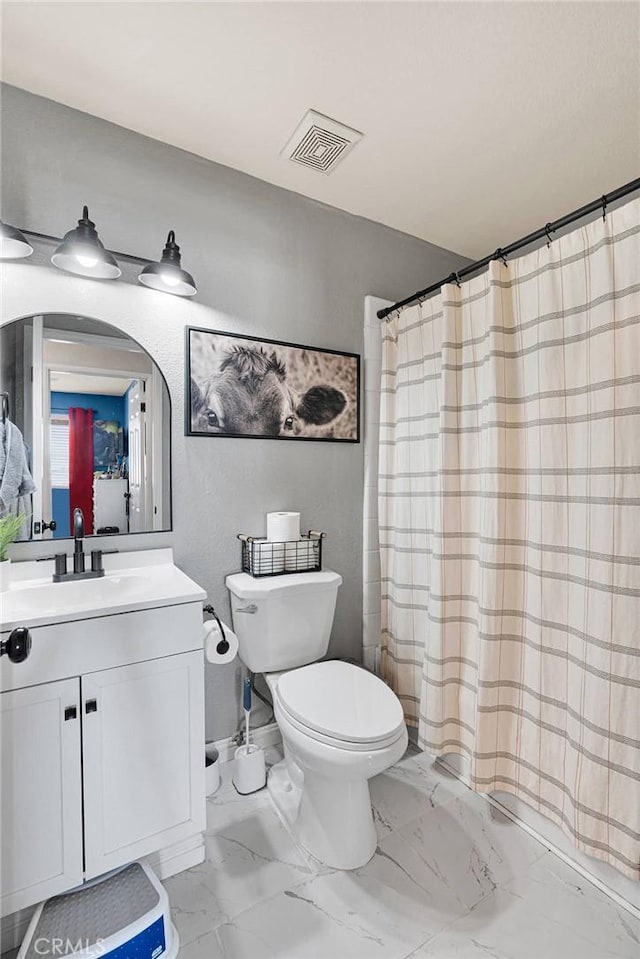 12546 Snapping Turtle Rd, Apple Valley, CA 92308 - bathroom featuring toilet, vanity, marble look tile flooring, and a shower with shower curtain