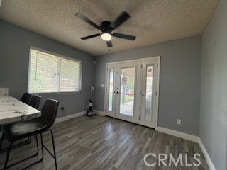 12546 Snapping Turtle Rd, Apple Valley, CA 92308 - office area with a textured ceiling, wood finished floors, baseboards, and a ceiling fan