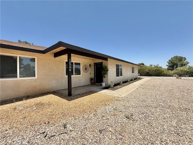 12546 Snapping Turtle Rd, Apple Valley, CA 92308 - view of front facade with stucco siding and a patio